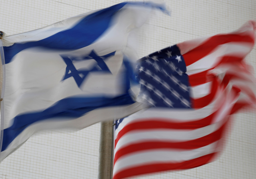 The American and the Israeli national flags can be seen outside the U.S Embassy in Tel Aviv, Israel 