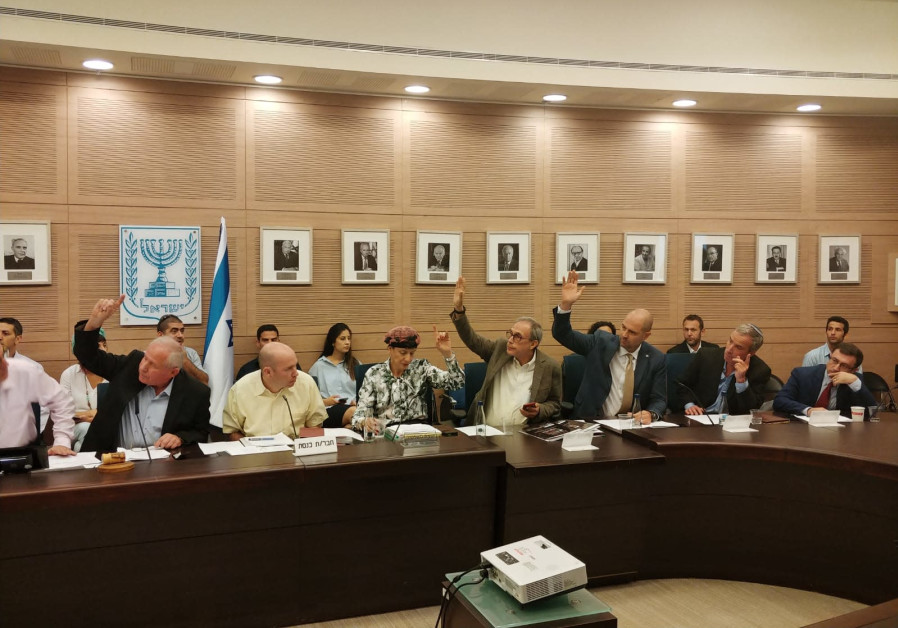 MKs voting in favor of the Pay for Slay bill Wednesday at the Knesset Foreign Affairs and Defense Co