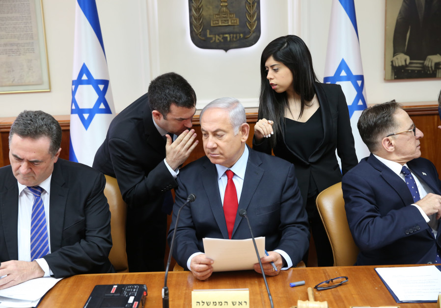 Prime Minister Benjamin Netanyahu whispering in cabinet government meeting on July 23, 2018