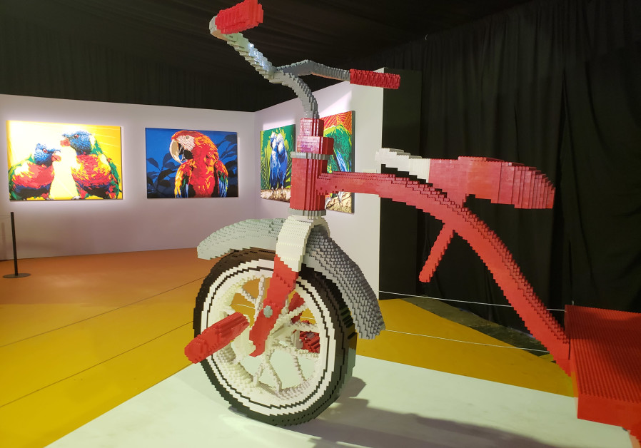 A Lego tricycle and Lego mosaic art of birds, near the entrance to the exhibit; Kenney's art is in both two and three dimensions. July, 25 2018