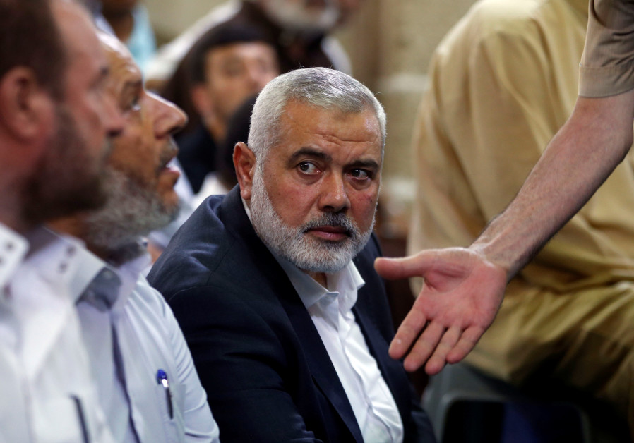 Hamas Chief Ismail Haniyeh looks on as he attends the funeral of Palestinian Hamas militants