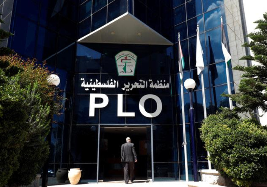 A man enters the headquarters of the Palestinian Liberation Organization (PLO), in Ramallah Septembe