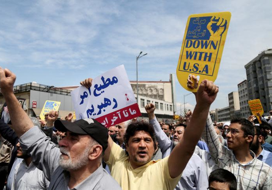 Iranians shout slogans during a protest in Tehran, Iran, against President Donald Trump