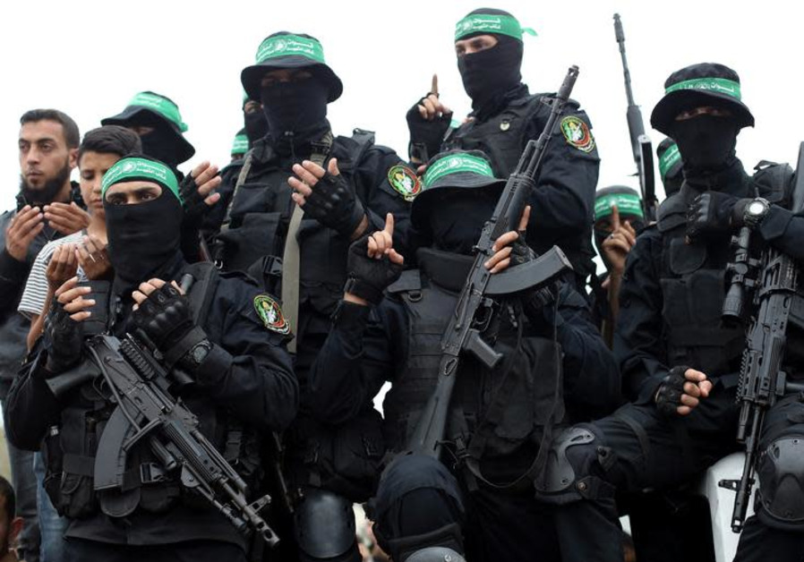 Palestinian Hamas militants attend the funeral of their comrades who were killed in an explosion, in