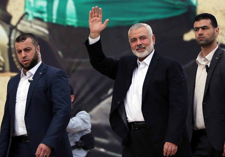 Hamas Chief Ismail Haniyeh gestures during a rally marking the 31st anniversary of Hamas' founding, 