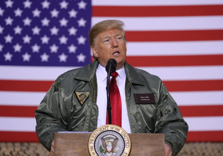 U.S. President Donald Trump delivers remarks to U.S. troops in an unannounced visit to Al Asad Air B