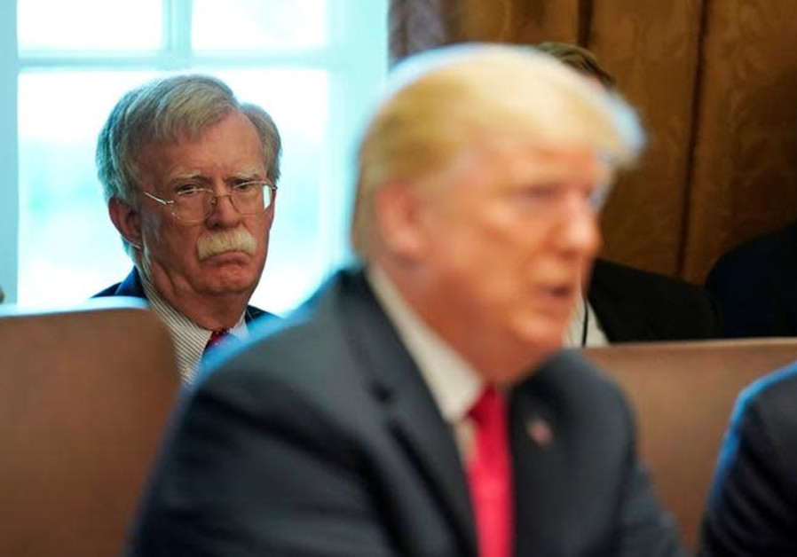 White House national Security Advisor John Bolton listens as U.S. President Donald Trump