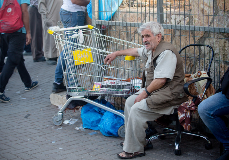 A man sells goods at Checkpoint 300. (Courtesy of Laura Ben-David)