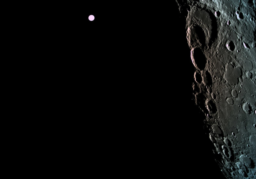 The surface of the moon captured by Beresheet with Earth in the background