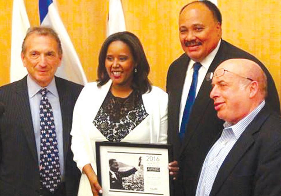 CCEPTING THE Martin Luther King Award in 2016, in the presence of King’s son (to her left) and then-Jewish Agency chairman Natan Sharansky. (Credit: Courtesy)