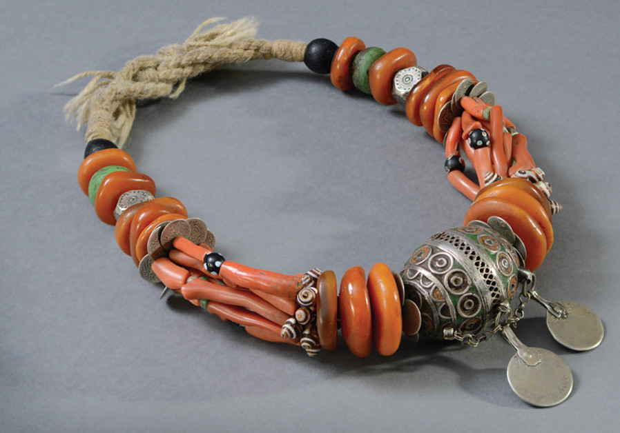 LATE-19TH-CENTURY necklace of silver, coral, amber, glass beads and cloisonné enamel, from the Dra’a Valley in Morocco. (Credit: SHAI BEN EFRAIM)