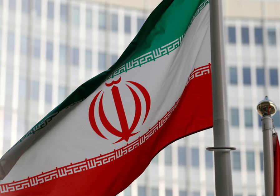 The Iranian flag flutters in front the International Atomic Energy Agency (IAEA) headquarters in Vie