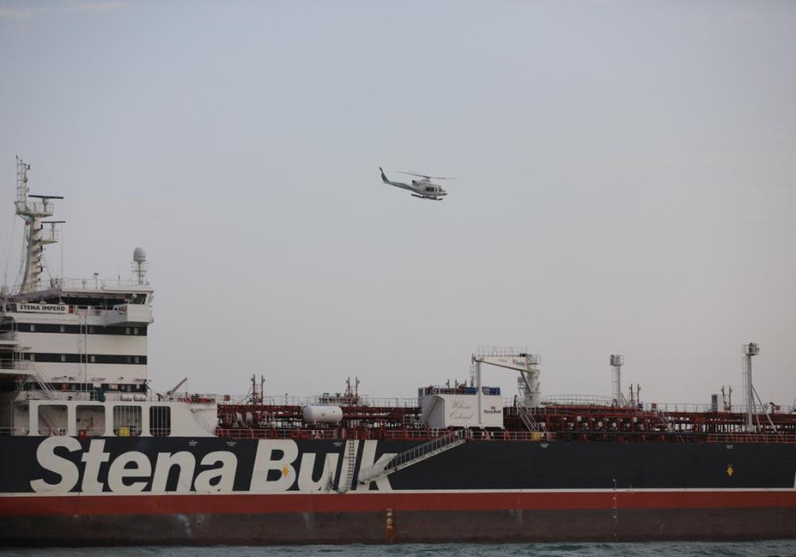 A helicopter of Iranian Revolutionary Guard flies over Stena Impero, a British-flagged vessel