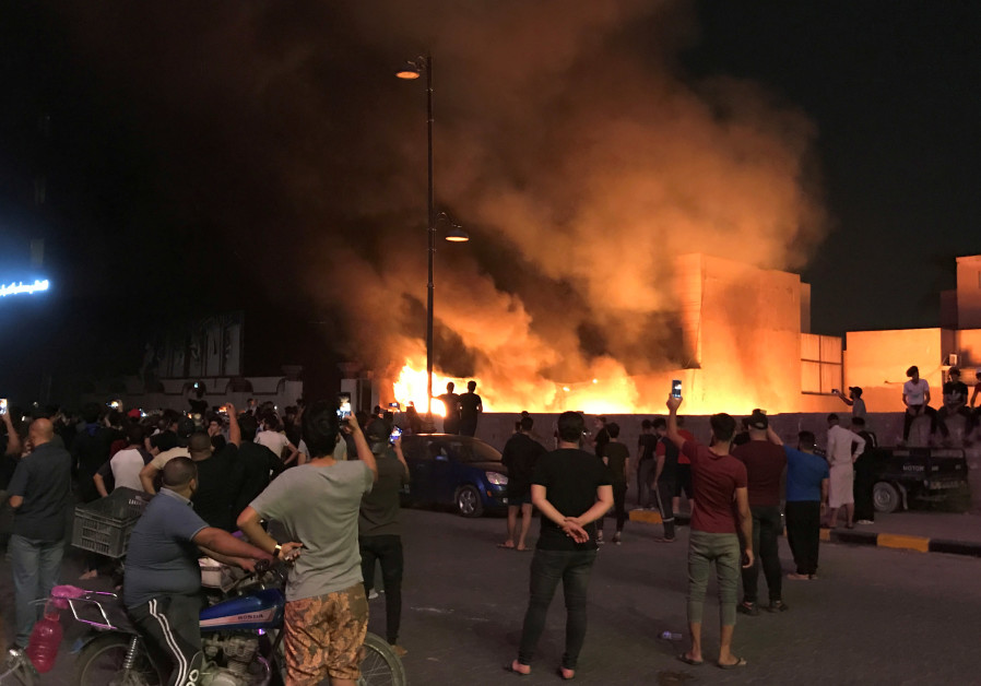 Demonstrators set on fire the Hikma movement building during a protest over unemployment, corruption