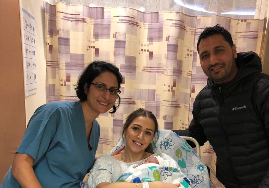 The Badran family, with their newborn daughter.