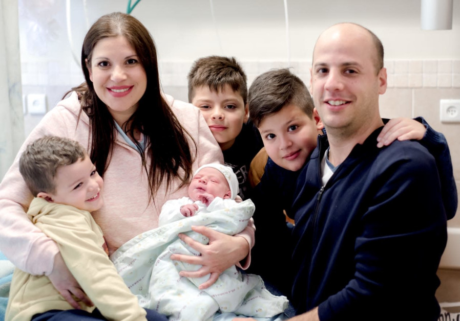 Hashiba (35) and Liran (36) Zuckman from Kiryat Motzkin, with their newborn and three boys.