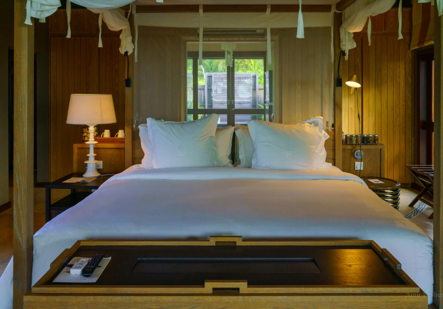 ONE OF the cozy beds at Four Seasons Desroches. (photo credit: AMIR LESHEM)