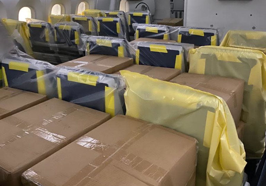 Several boxes filled with surgical masks are seen Thursday night on board an El Al flight. (Credit: Foreign Ministry)