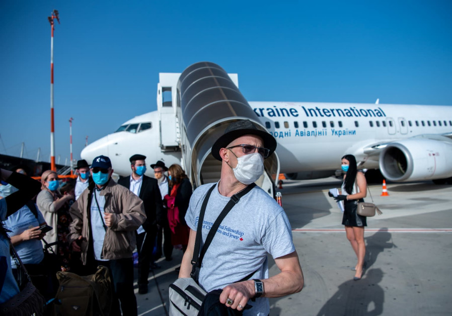Jews making aliyah from Ukraine arrive on  International Fellowship of Christians and Jews sponsored flight (Credit: Arik Shraga)