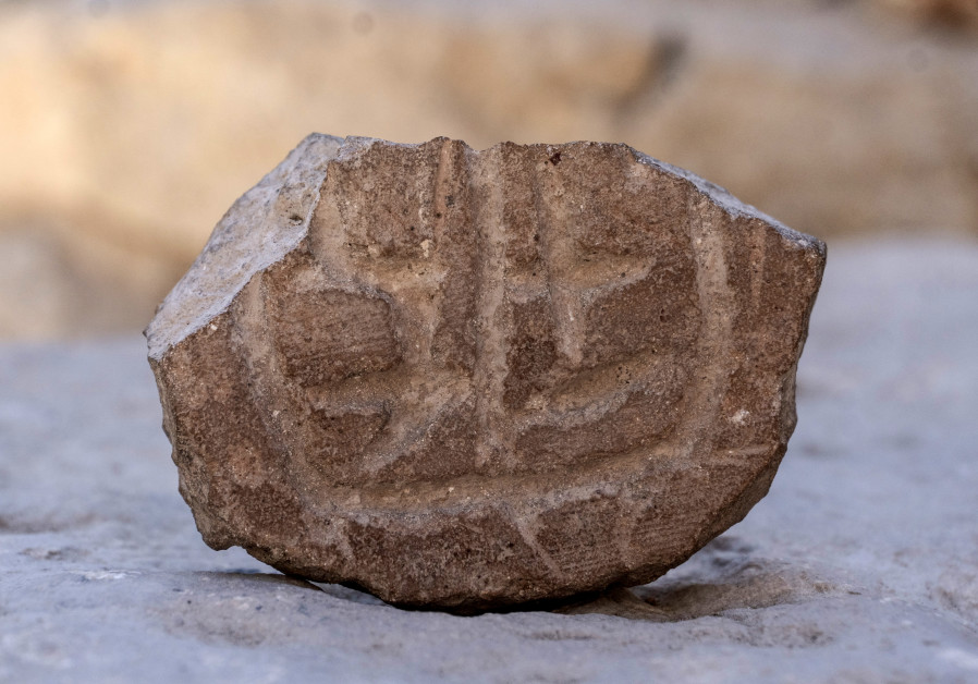 A seal made out of clay, dating from the Persian period (Photo Credit: Shai Halevy/Israel Antiquities Authority)