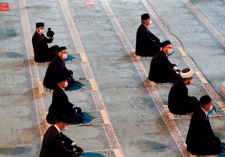 Clergymen keep social distance while attending a prayer marking the Muslim festival of Eid al-Adha, amid the coronavirus disease (COVID-19) outbreak, in Moscow's grand mosque in Russia ,July 31, 2020. (Credit: REUTERS/Shamil Zhumatov)
