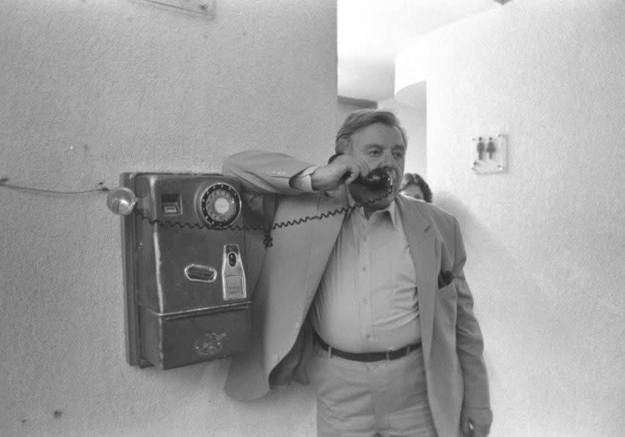  The late Teddy Kollek, legendary mayor of Jerusalem, talks on a public phone. (Photo credit: Nati Harnik / GPO)