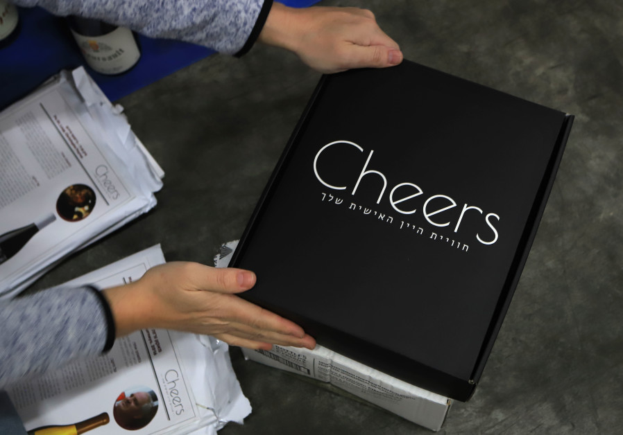 HAIDU PACKS gift boxes for the Cheers start-up initiative. (Credit: David Silverman/DPS Images)