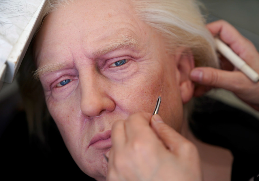 A technician works on a wax figure of US President Donald Trump at a workshop of Shanghai Maiyi Arts, following the global outbreak of the coronavirus disease, in Shanghai, China, August 21, 2020 (Credit:Reuters/Aly Song)