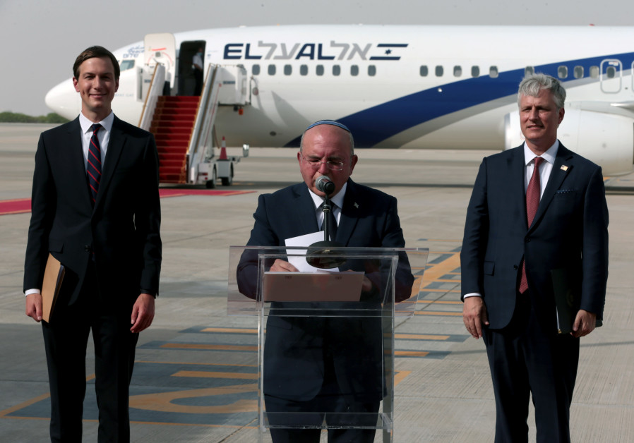 Meir Ben-Shabbat speaks as Jared Kushner and Robert O'Brien stand next to him, having landed in the UAE (REUTERS/CHRISTOPHER PIKE)