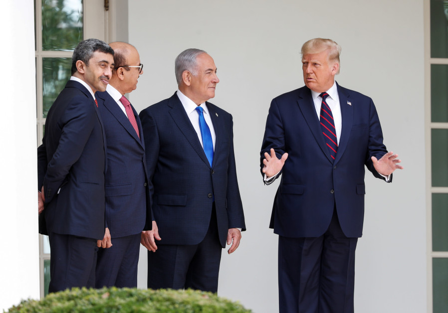 US President Donald Trump speaks United Arab Emirates Foreign Minister Abdullah bin Zayed, Bahrain’s Foreign Minister Abdullatif Al Zayani and Israel's Prime Minister Benjamin Netanyahu prior to signing the Abraham Accords, normalizing relations between Israel and some of its Middle East neigbors (Credit: Reuters/Tom Brenner)