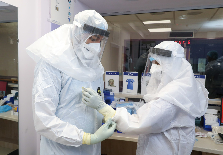 Preparing to enter the coronavirus ICU at Galilee Medical Center (Photo credit: Marc Israel Sellem)