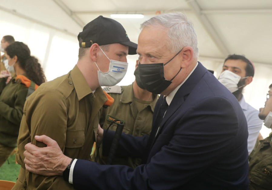 Defense Minister Benny Gantz, Welfare Minister Itzik Shmuli, and commander of the Home Front Command Maj.-Gen. Uri Gordin meet with people with disabilities who volunteer in the IDF, December 4, 2020. (Credit: Elad Malka)