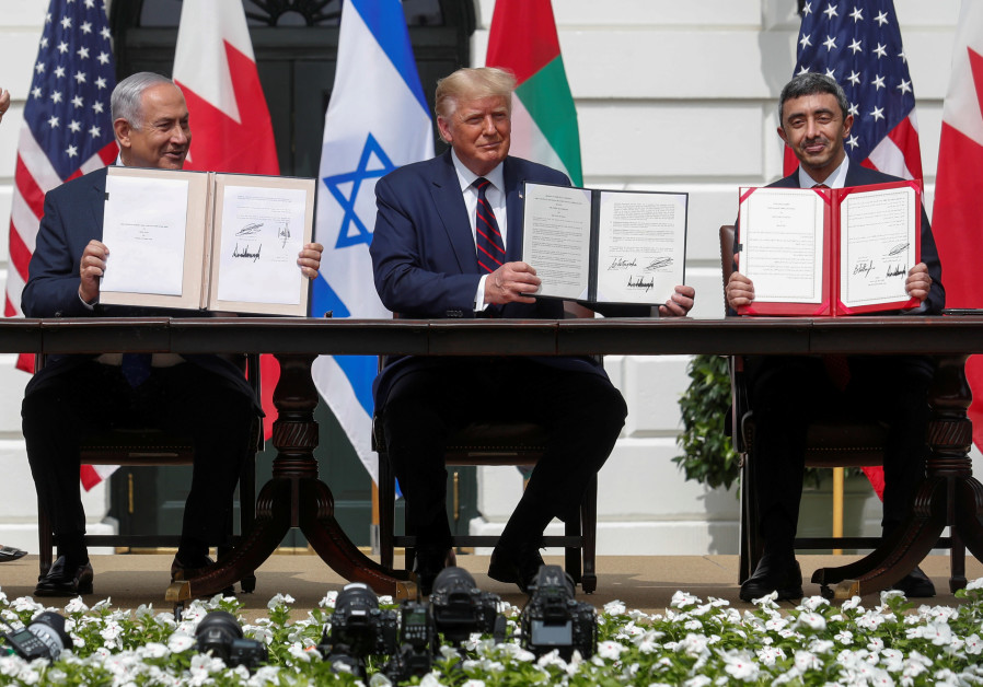 PRIME MINISTER Benjamin Netanyahu, US President Donald Trump and UAE Foreign Minister Abdullah bin Zayed signed normalization deals at the White House on September 15 (REUTERS/TOM BRENNER).