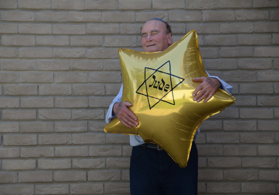 David “Dugo” Leitner poses with yellow Star of David balloon (Erez Kaganovitz)