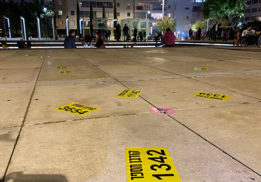 Notes scattered throughout Habima Square in Tel Aviv by protesters, symbolizing the 4,600 victims of the coronavirus in Israel, Saturday, January 30, 2021. (Credit: Sassoni Avshalom)