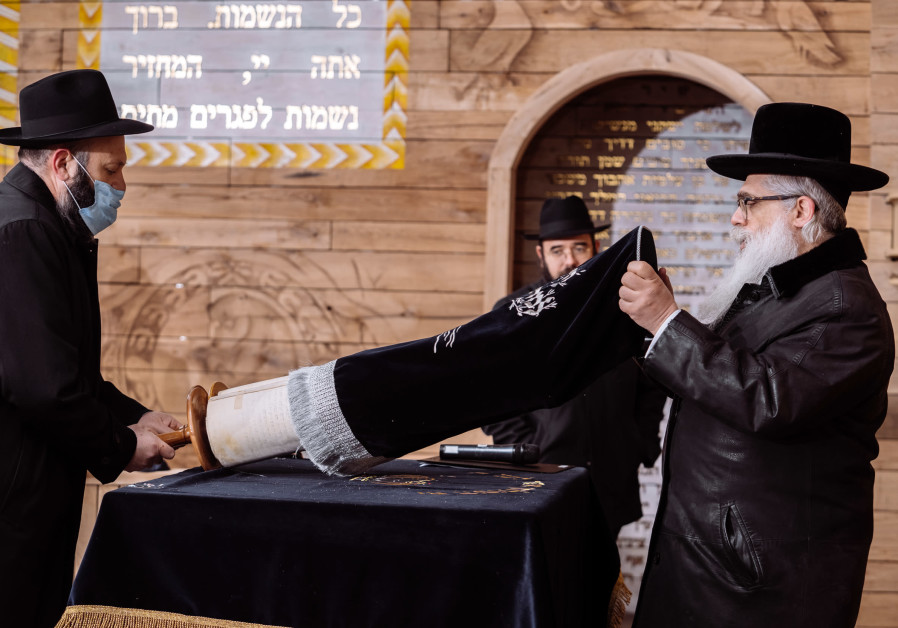 Opening of a Torah scroll at Babyn Yar (BYHMC).