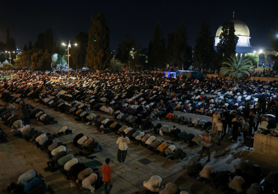Palestinians pray on Laylat al-Qadr during the holy month of Ramadan, at the compound that houses Al-Aqsa Mosque, known to Muslims as Noble Sanctuary and to Jews as Temple Mount, in Jerusalem's Old City, May 8, 2021. (Credit: Ammar Awad/Reuters) 