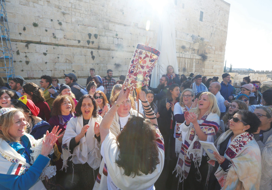 DANCING WITH a Torah at the Kotel. (Photos: Marc Israel Sellem/The Jerusalem Post)