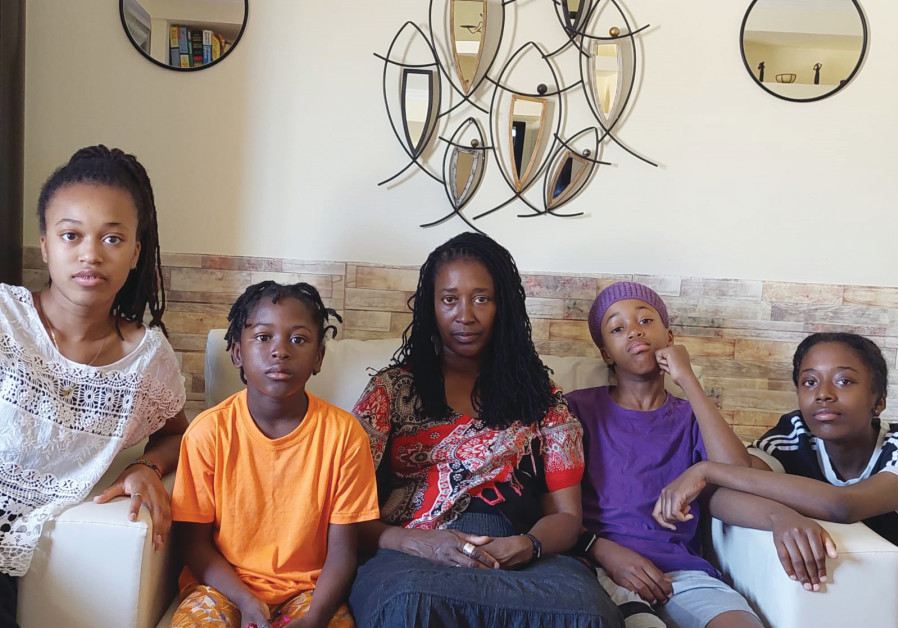 TOVEET ISRAEL, who is due to be deported, with some of her children 