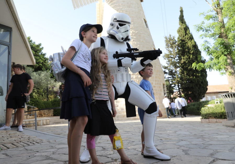 Volunteers from Israel's 501st Outpost meet with children (Credit: Marc Israel Sellem)