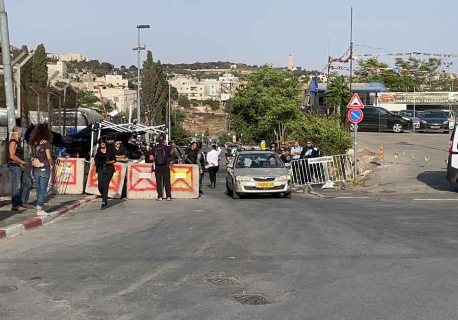 Image Name : Israel Border Police are seen standing at the entrance to Sheikh Jarrah at a joint Jewish and Arab demonstration, May 21, 2021. (Credit: Niv Beili)