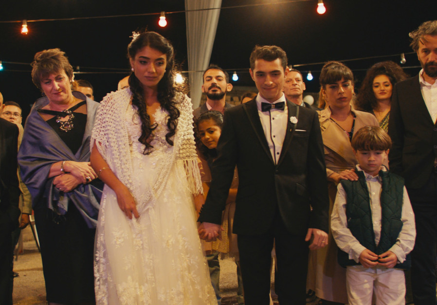 A group of people at wedding is from Eran Kolirin's Let There Be Morning (Credit: Shai Goldman)