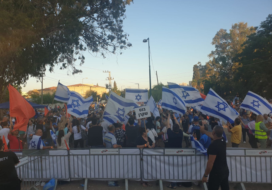 PROTESTERS GATHER outside Yamina MK Nir Orbach's house to protest against his decision to join the change government, June 7, 2021.(Credit: Y. COHEN)