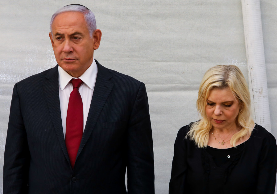 Former prime minister Benjamin Netanyahu with his wife Sara at a memorial service for his brother Yoni Netanyahu at Mount Herzl, June 16 2021. (Credit: MARC ISRAEL SELLEM/THE JERUSALEM POST)