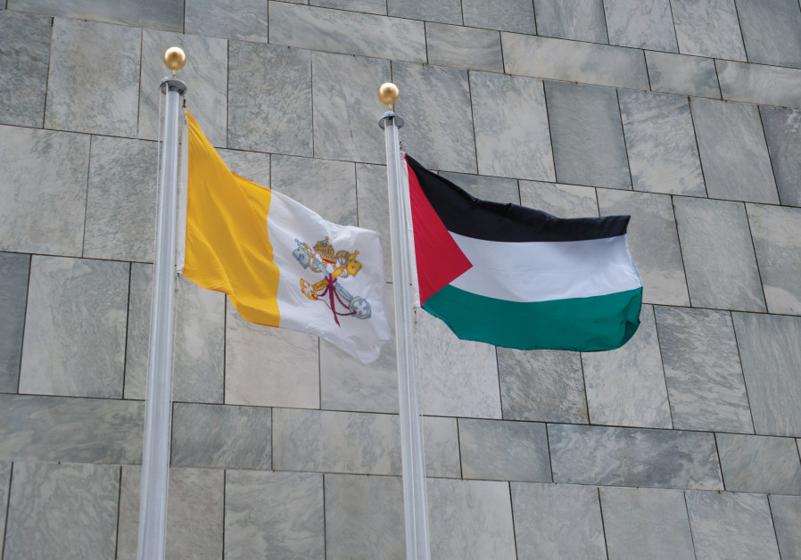 THE PALESTINIAN flag (right) flies at UN headquarters in New York City, next to that of the Holy See. (UNITED NATIONS PHOTO/FLICKR)