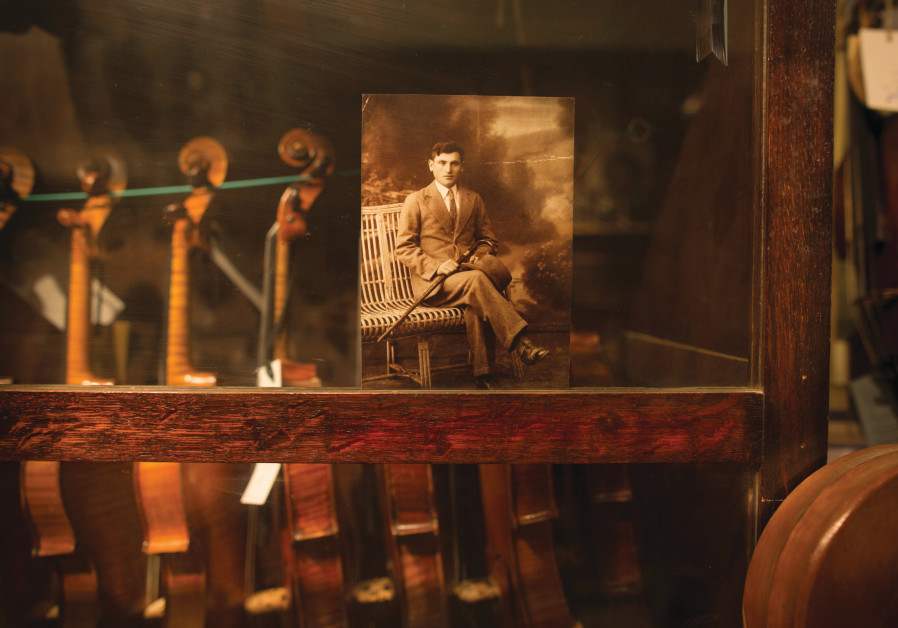 PORTRAIT OF Asael Bielski in Weinstein’s violin cabinet. (DANIEL LEVIN)