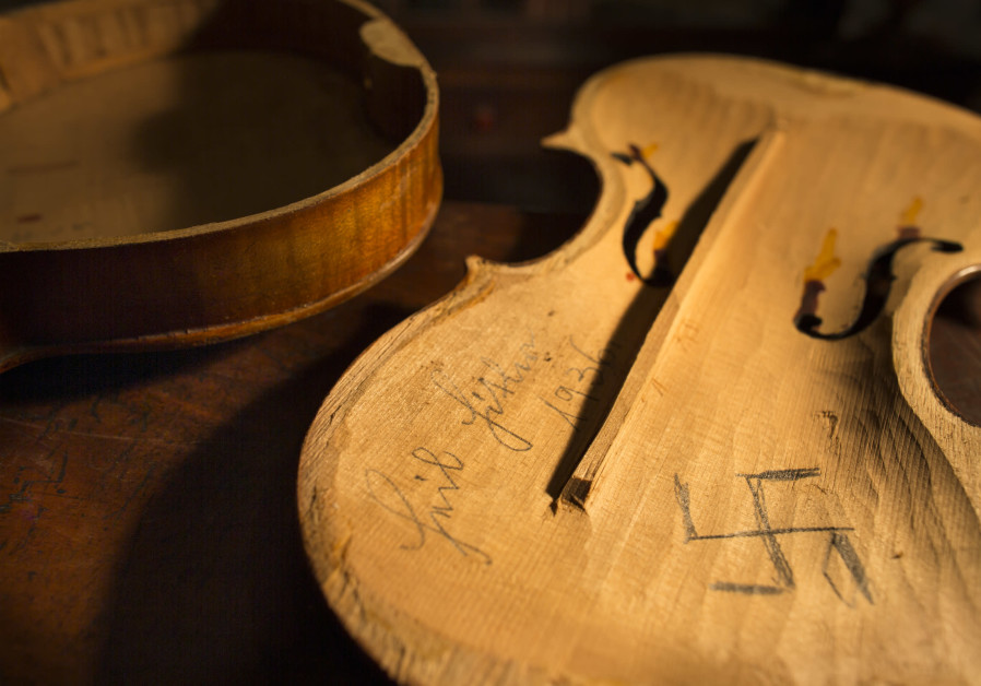 THE ‘HEIL Hitler 1936 swastika’ violin Weinstein chose not to reassemble following his discovery of the desecration. (DANIEL LEVIN)
