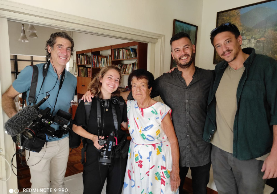 Uriya Rosenman, right, and Sameh Zakout, second from right, visit one of Zakout's Jewish neighbors in the mixed Arab and Jewish city of Ramla during taping for a documentary. (Credit: Pierre Assouline)
