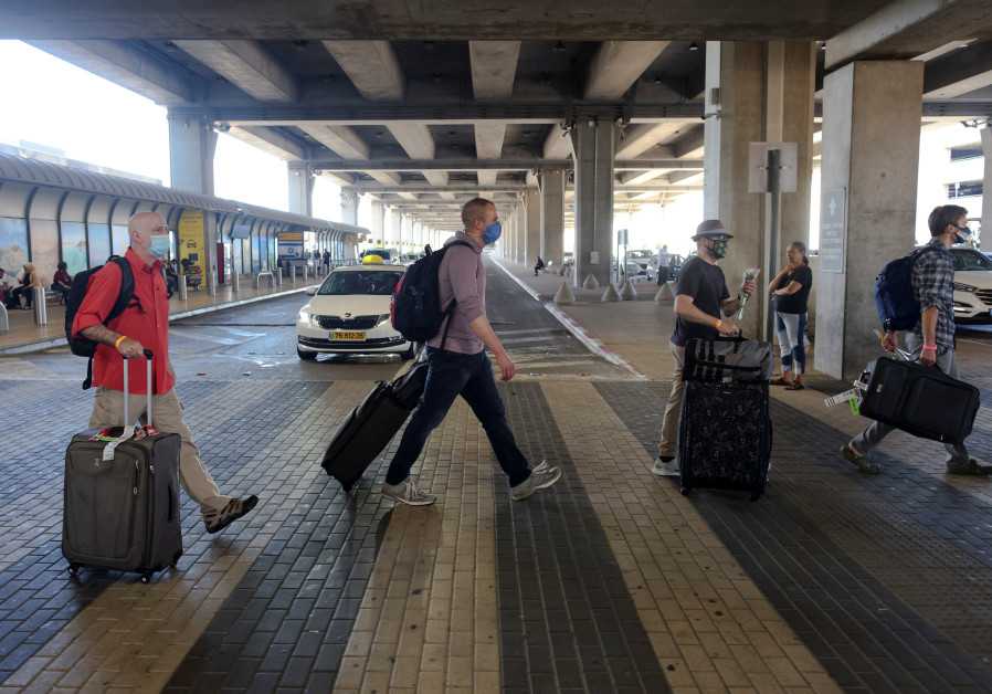 Tourists walk at the Ben Gurion International Airport after entering Israel by plane, as coronavirus disease (COVID-19) restrictions ease, in Lod, near Tel Aviv, Israel (Credit: Reuters)