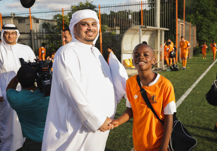 Saoud Shaker meets an Ethiopian-Israeli boy. (Courtesy)